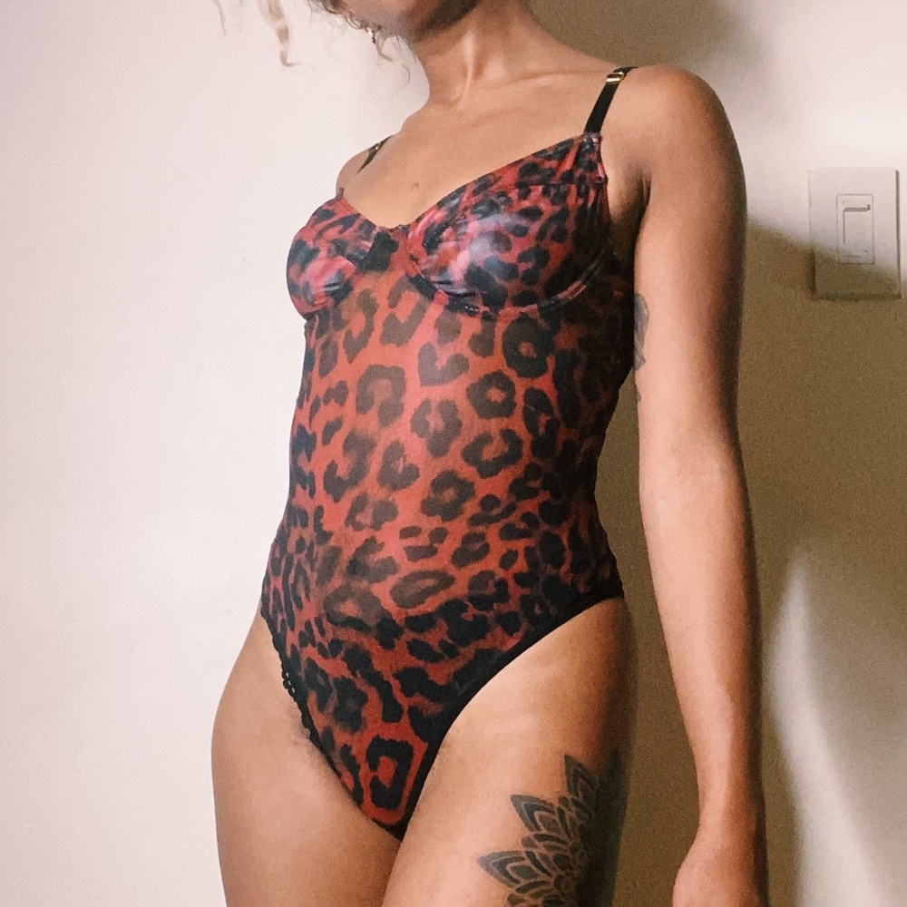 Red Leopard Print Bodysuit. Never been worn.